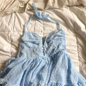 Blue dot babydoll mini dress with ruffles and low V neckline